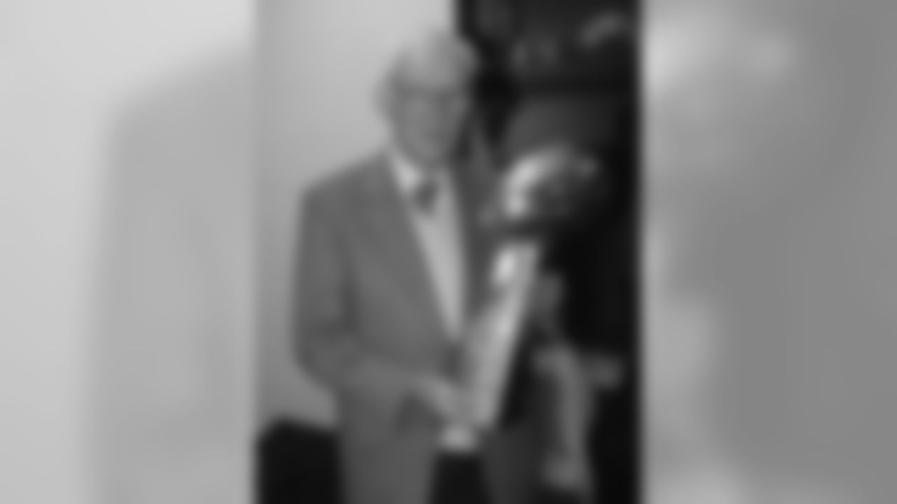 Dan Rooney stands in the locker room with the Lombardi trophy after winning Super Bowl XL.
