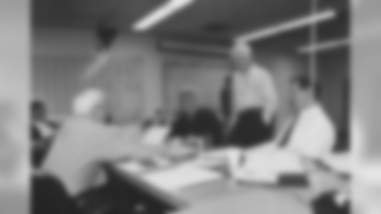 Dan Rooney talks with Coach Bill Cowher, Tom Modrak and Tom Donahoe in the Draft Room.