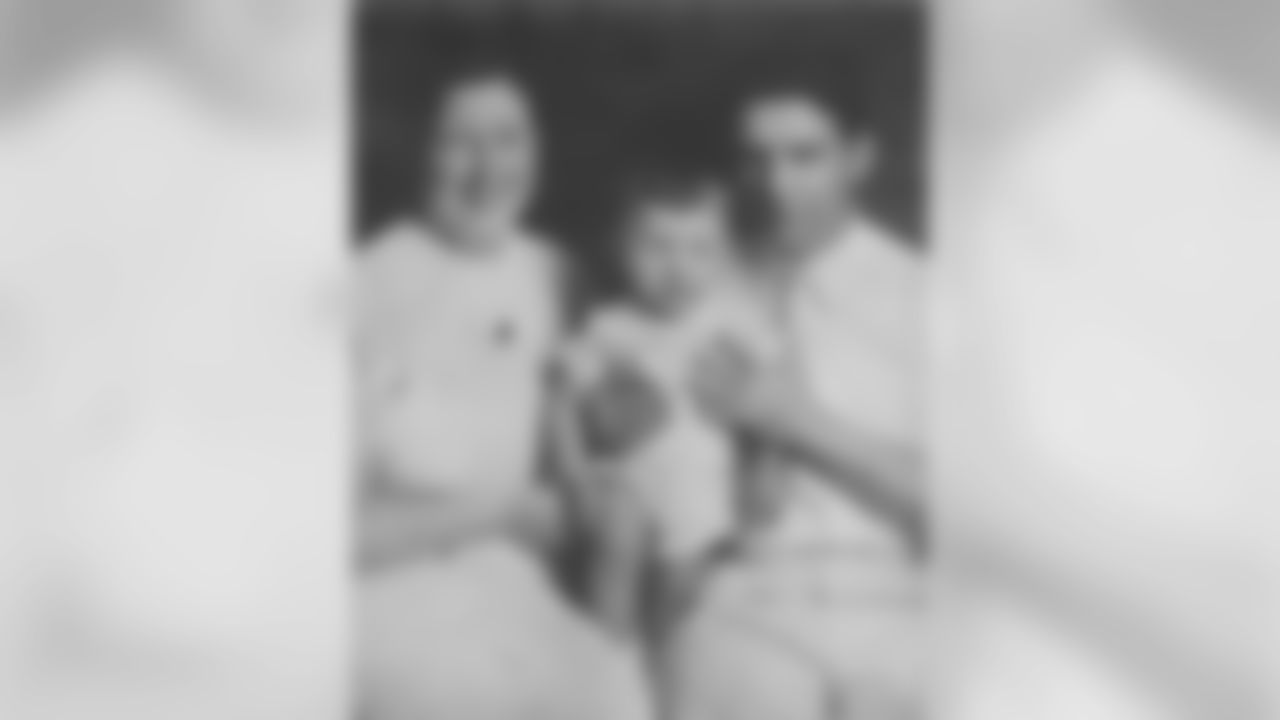 Dan Rooney as a baby with his mother and father.