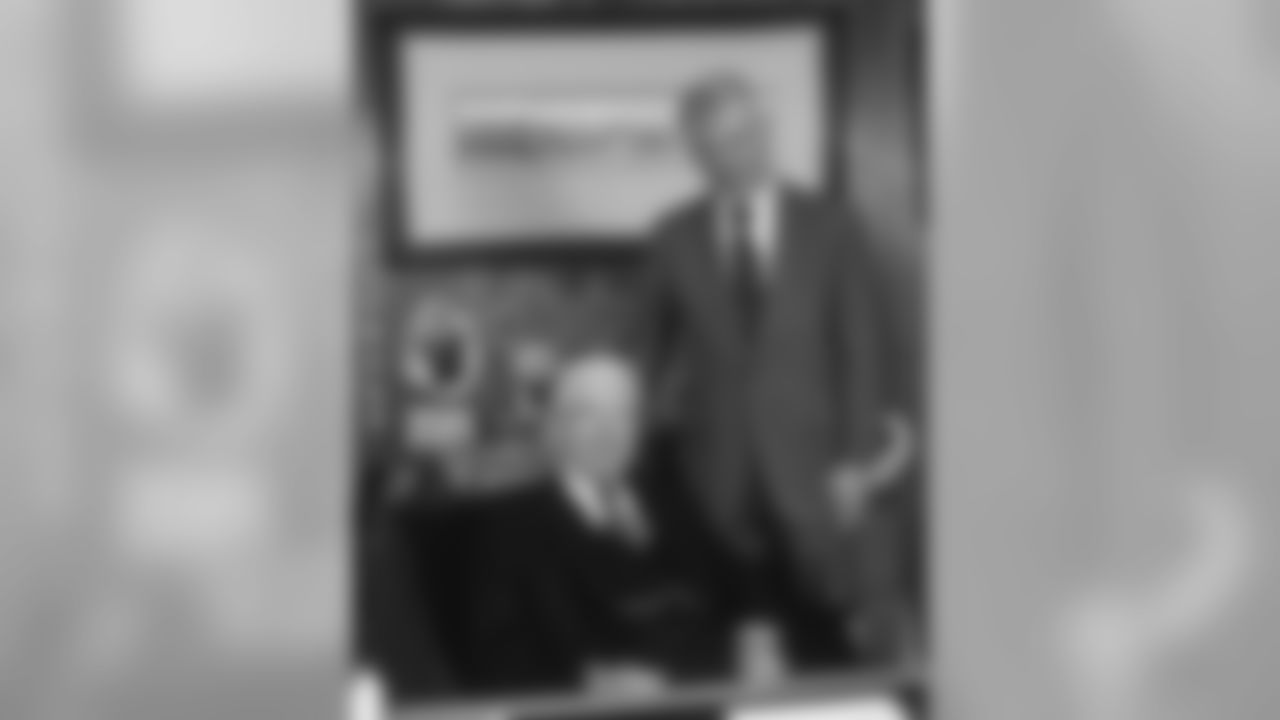 Dan Rooney poses for a photo with his father Art Rooney.