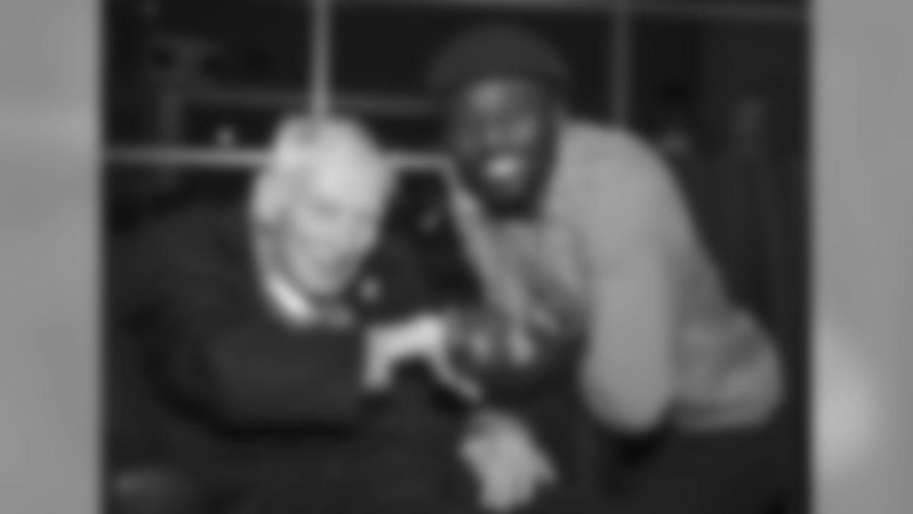 Dan Rooney poses for a photo with Santonio Holmes during an Alumni dinner at Heinz Field.