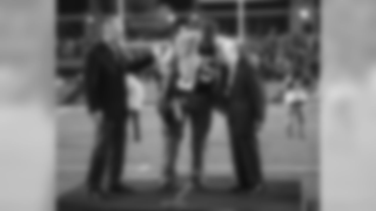 Joe Greene gives Dan Rooney a hug during his jersey retirement at Heinz Field.