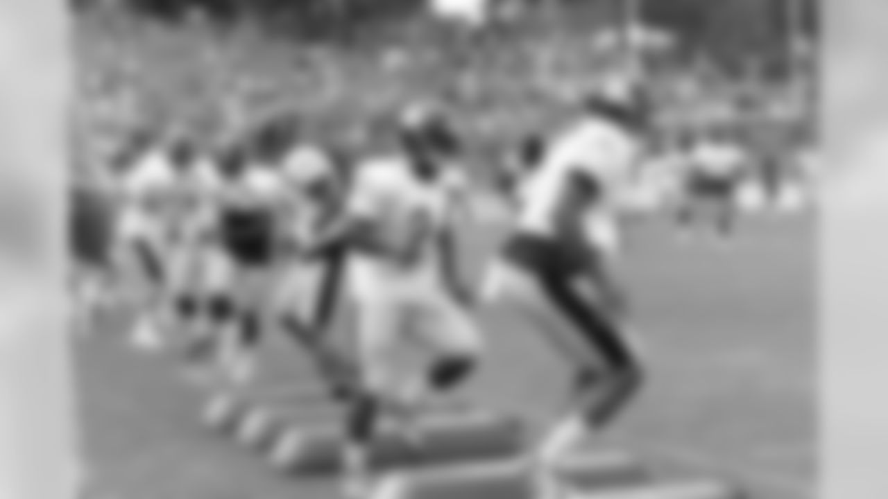 RB Brandon Brown-Dukes (24) and WR Marcus Tucker (17)