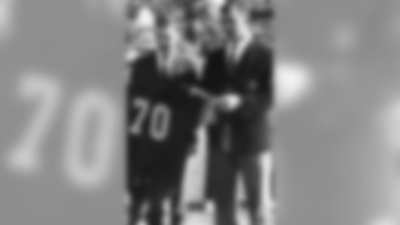 Dan Rooney stands with Ernie Stautner during a jersey retirement ceremony.