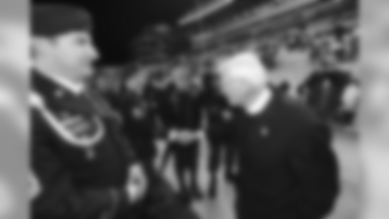 Dan Rooney shakes hands with a group of Navy Seals before a game against the Baltimore Ravens, November 6, 2011.