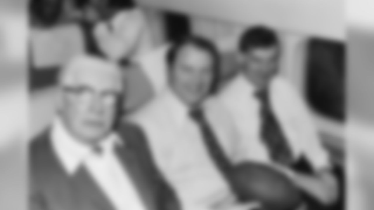 Art Rooney, Chuck Noll and Dan Rooney sitting on the team plane heading for Super Bowl IX.