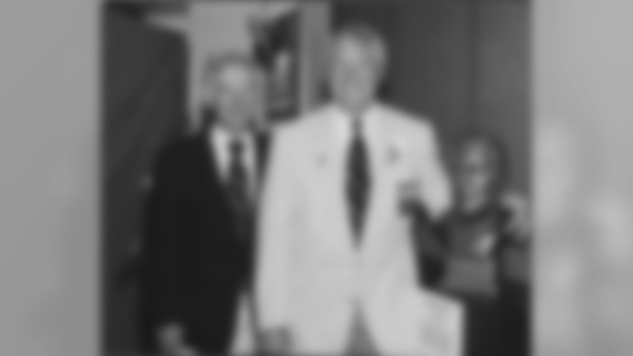 Dan Rooney stands along side Chuck Noll and his bust during the Hall of Fame induction ceremonies in 1993.