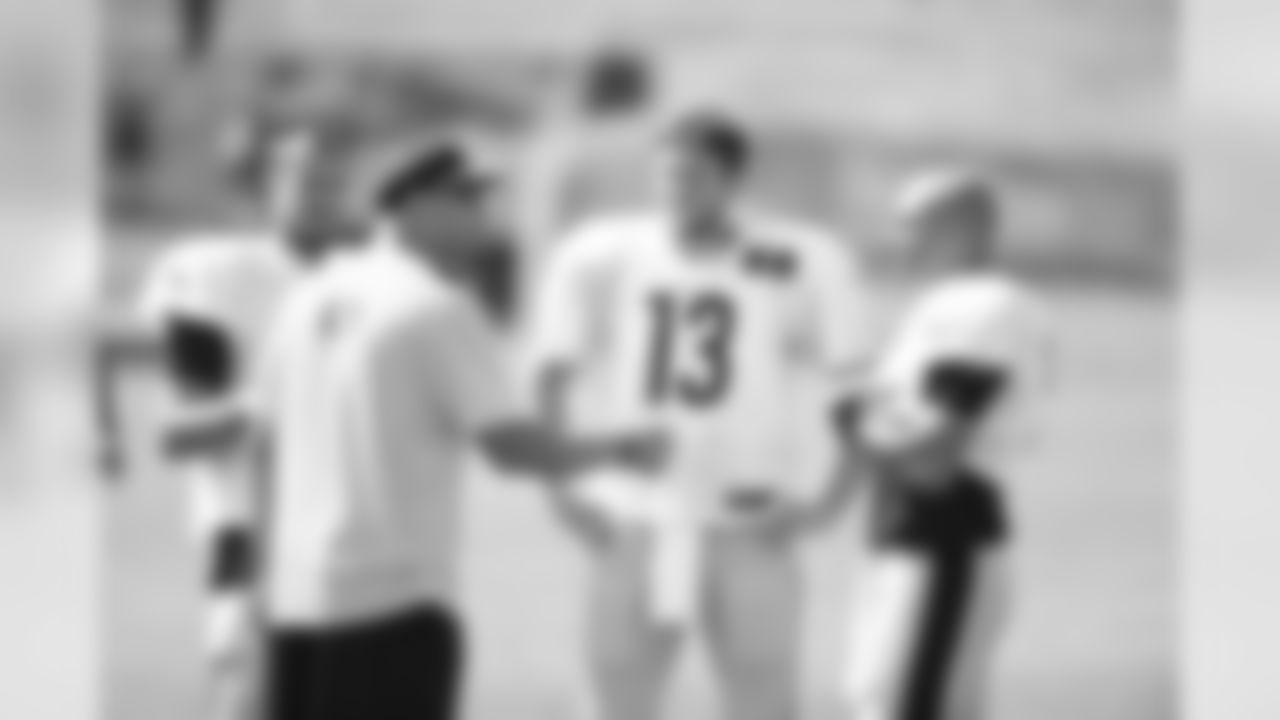 Former Steelers QB Charlie Batch talks with QBs Landry Jones (3), Dustin Vaughan (13) and Bruce Gradkowski (5)