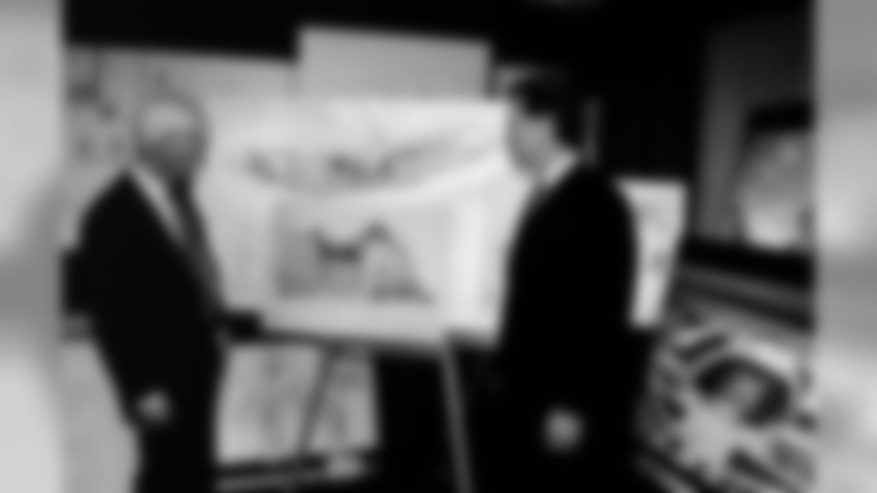Dan Rooney and Art Rooney II review plans together for the construction of Heinz Field.