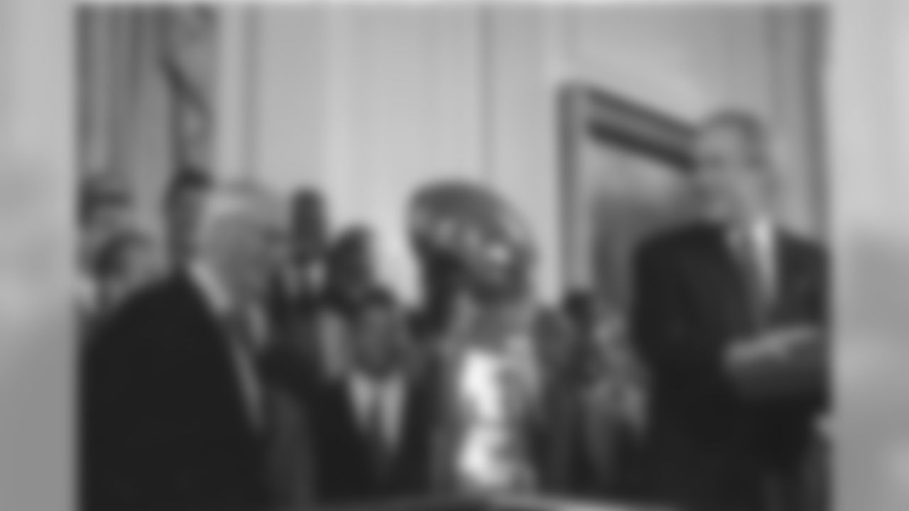 Dan Rooney stands with President George W. Bush during the Steelers White House visit after winning Super Bowl XL.