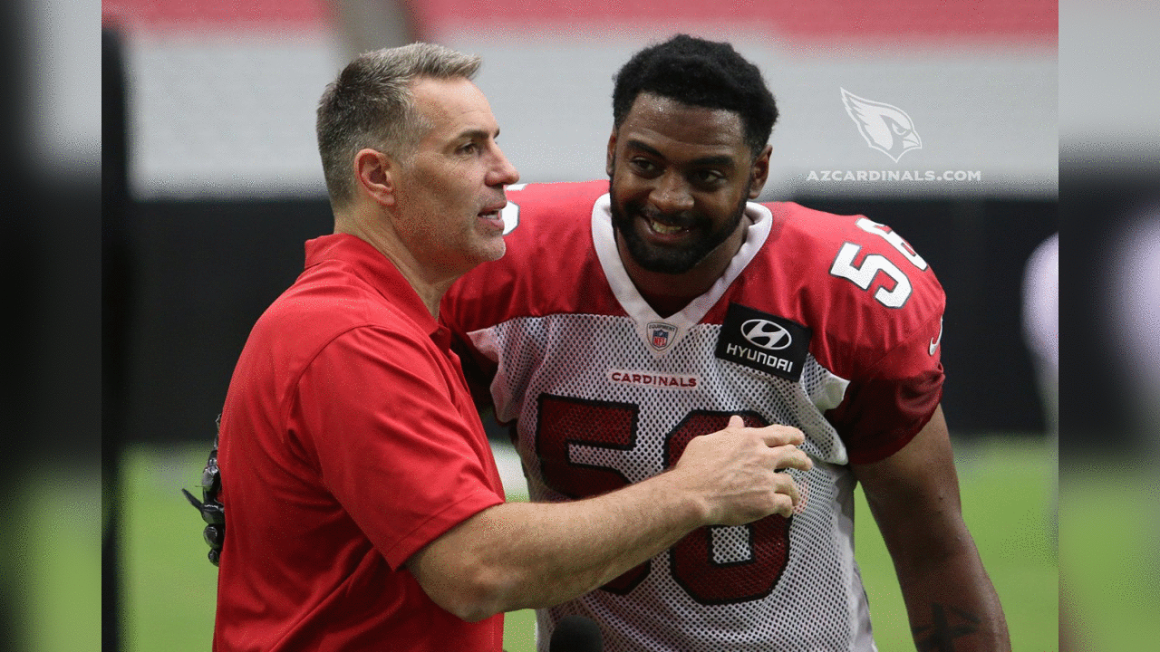 Hall of Famer/NFL Network reporter/former Cardinals quarterback Kurt Warner gets a welcome hug from former teammate Karlos Dansby
