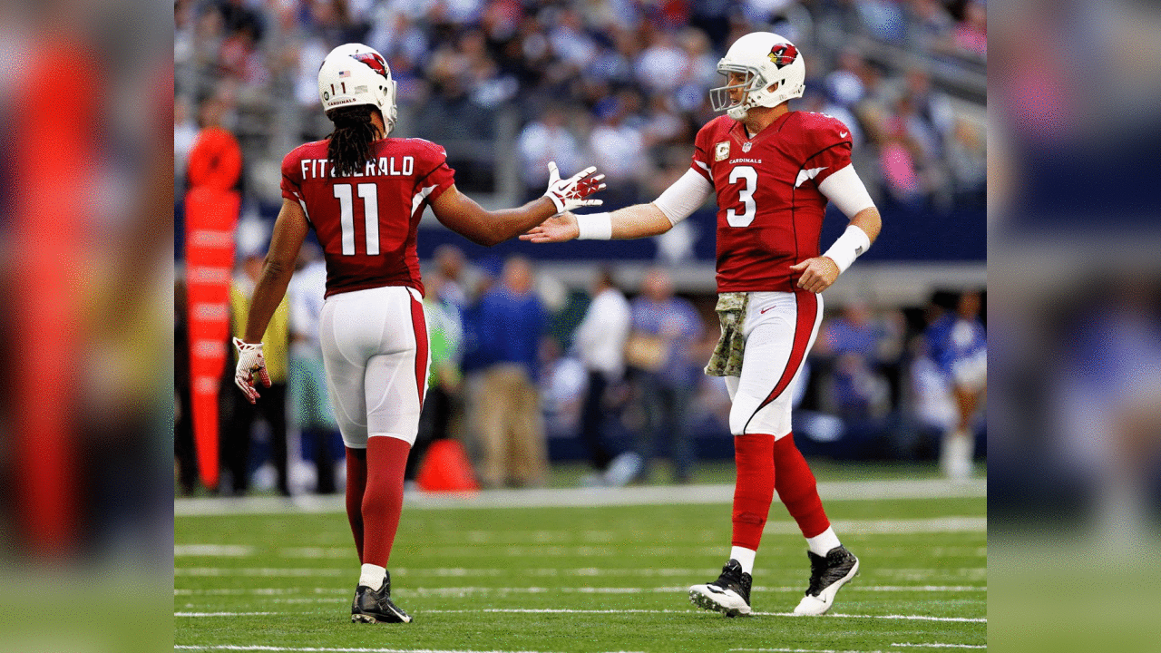 QB Carson Palmer (right) and WR Larry Fitzgerald celebrate during the Cowboys game in 2014