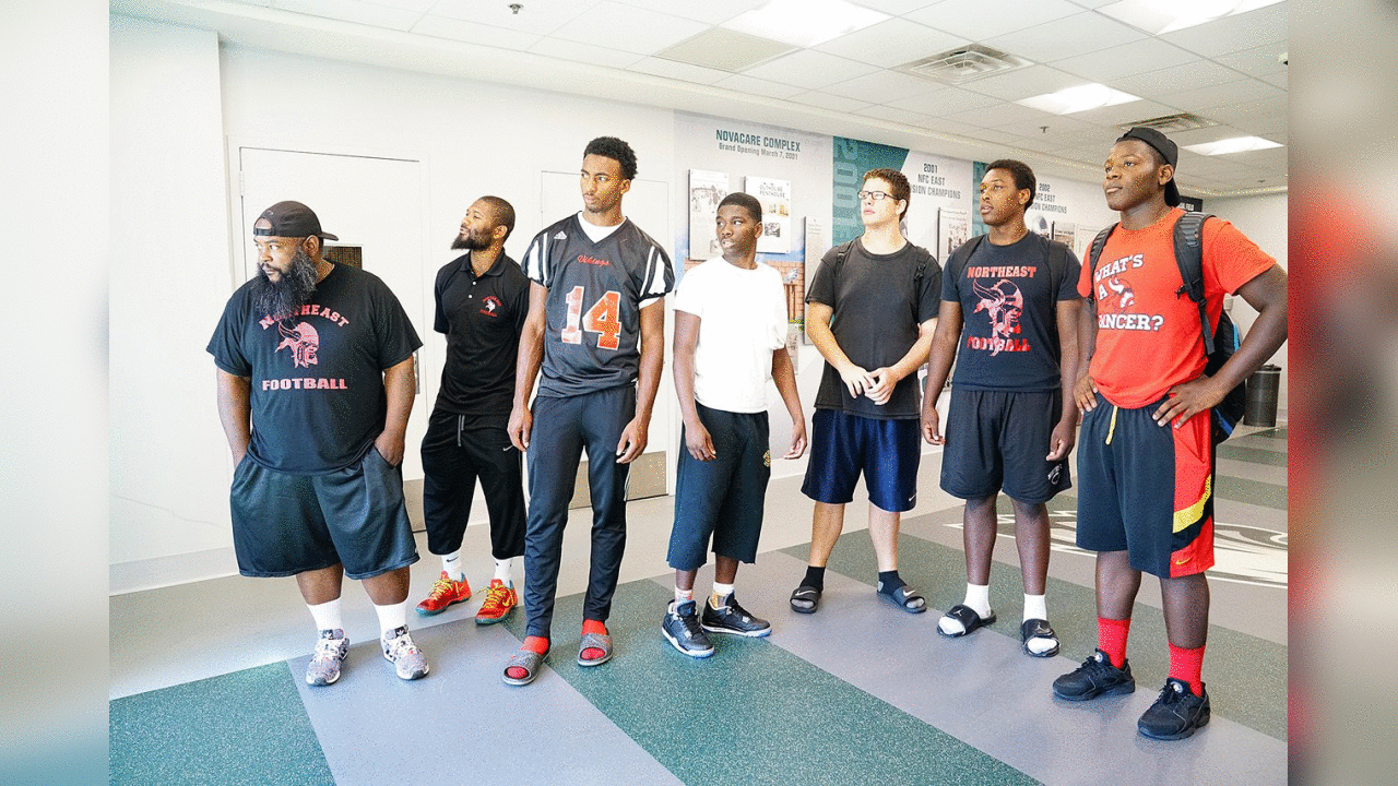 On Wednesday, a few players and coaches from the Northeast High School football team came to the NovaCare Complex for a surprise cleat donation.