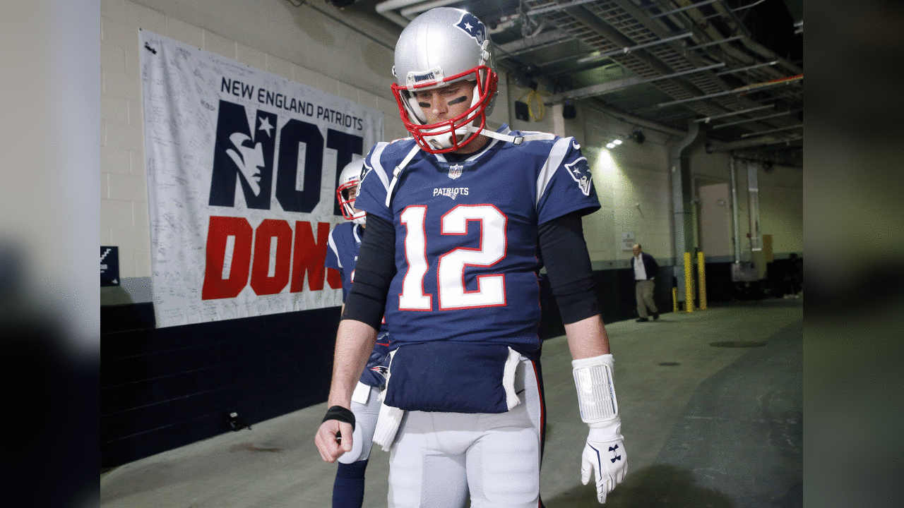 New England Patriots quarterback Tom Brady walks toward the field to warm up before the AFC championship NFL football game against the Jacksonville Jaguars, Sunday, Jan. 21, 2018, in Foxborough, Mass. (AP Photo/Winslow Townson)