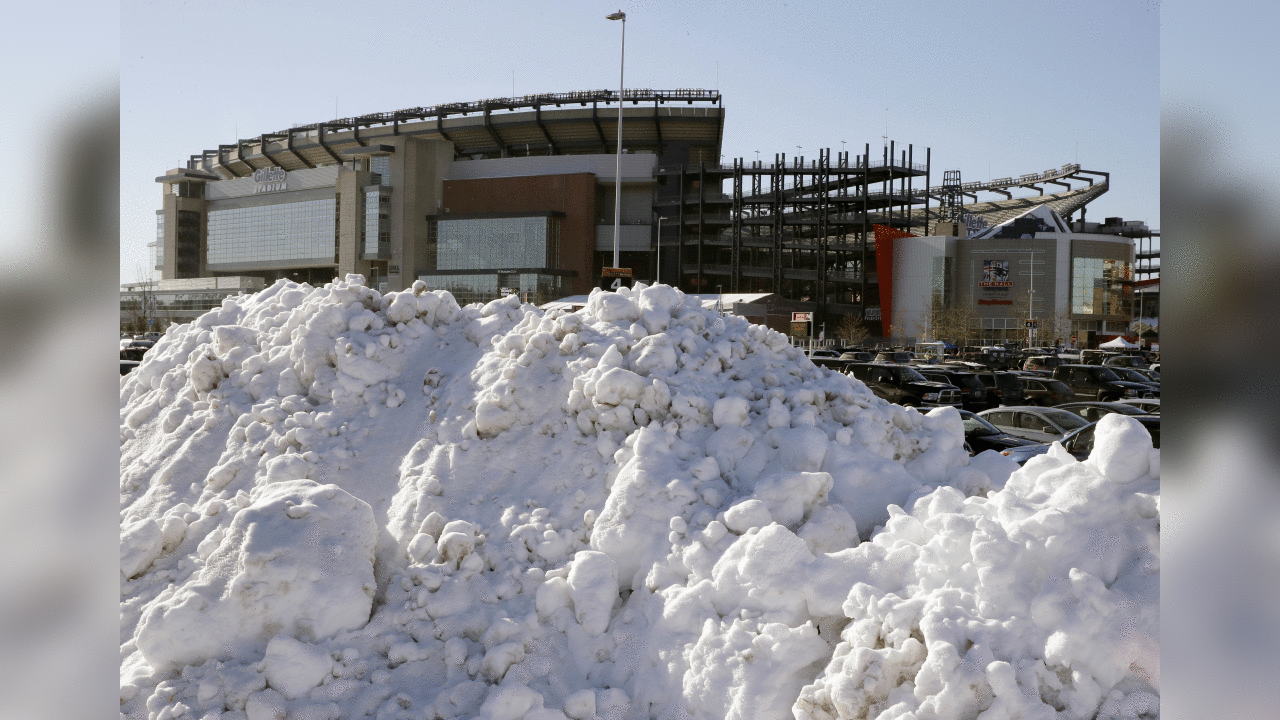 A big pile of snow sits in the parking lot of Gillette Stadium before an NFL football game between the New England Patriots and the New York Jets, Sunday, Dec. 31, 2017, in Foxborough, Mass. (AP Photo/Charles Krupa)