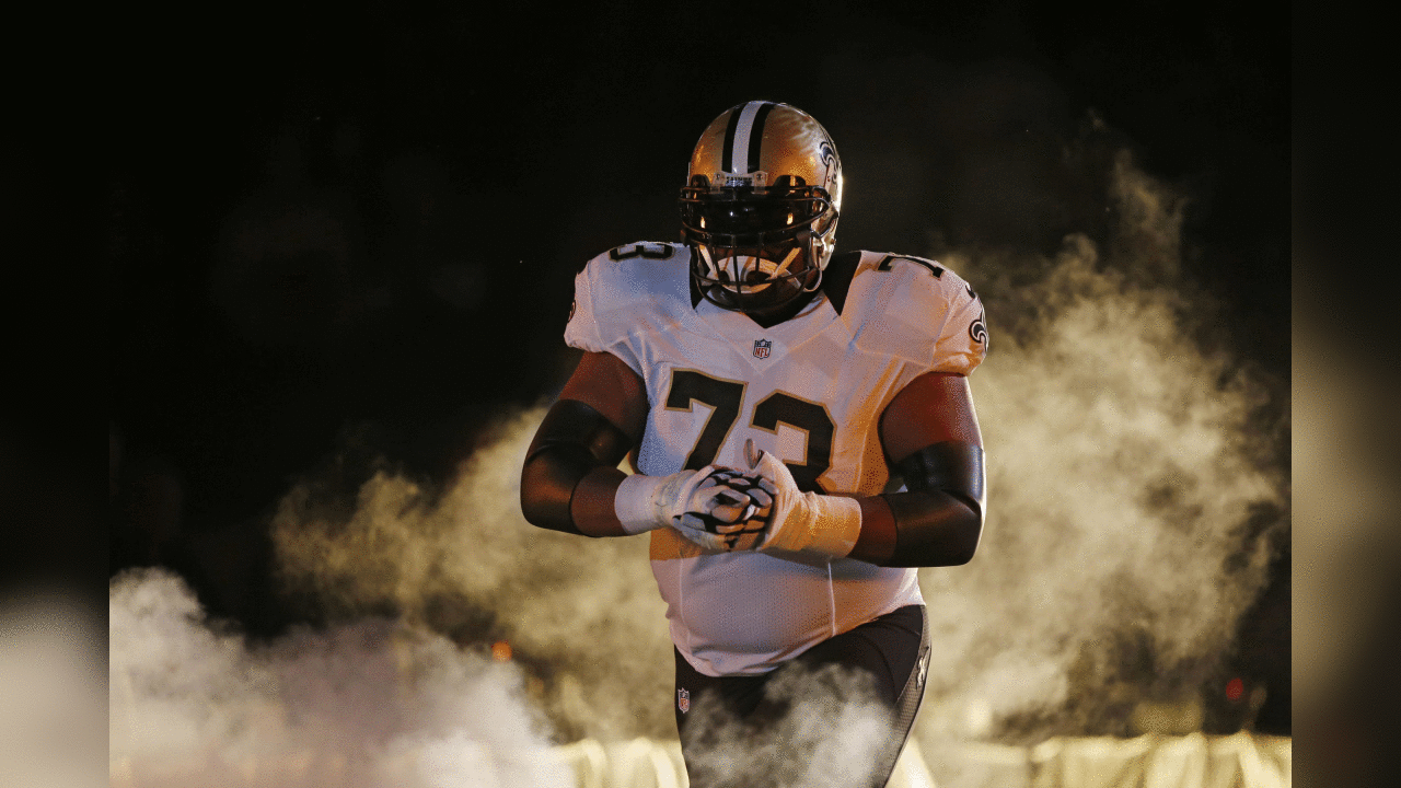 New Orleans Saints guard Jahri Evans (73) walks onto the field during player introductions before an NFL football game in New Orleans, Sunday, Sept. 20, 2015. (AP Photo/Jonathan Bachman)