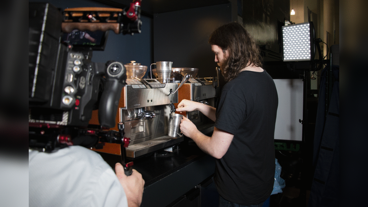 Latte artist Kale Lotton works on the Seahawks schedule release video.