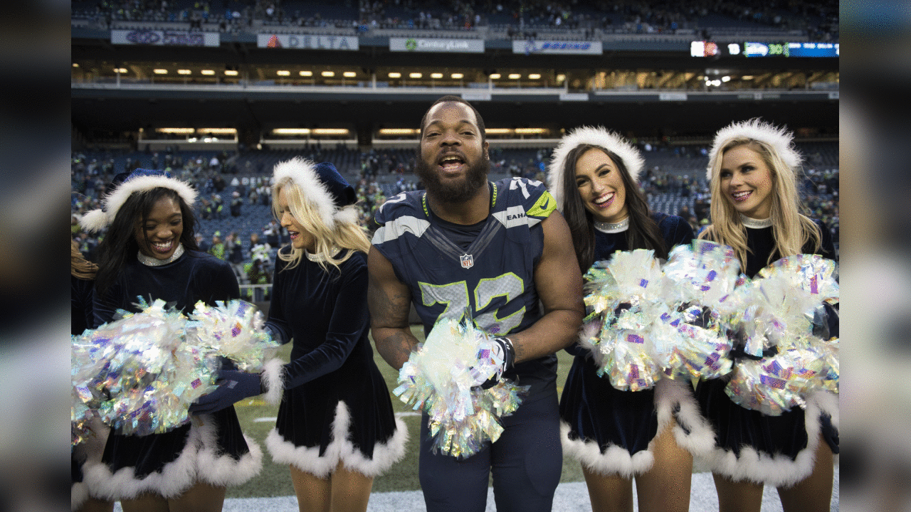 Michael Bennett, who often refers to himself as "Black Santa", got into the holiday spirit with the Sea Gals after the game.