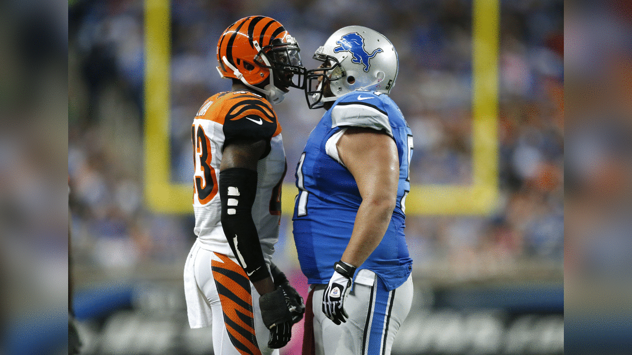 Cincinnati Bengals strong safety George Iloka, left, and Detroit Lions center Dominic Raiola, right, talk after a play in the second quarter of an NFL football game against Sunday, Oct. 20, 2013, in Detroit. (AP Photo/Rick Osentoski)