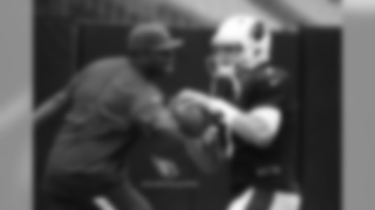 QB Blaine Gabbert tries to avoid QB coach Byron Leftwich in a drill