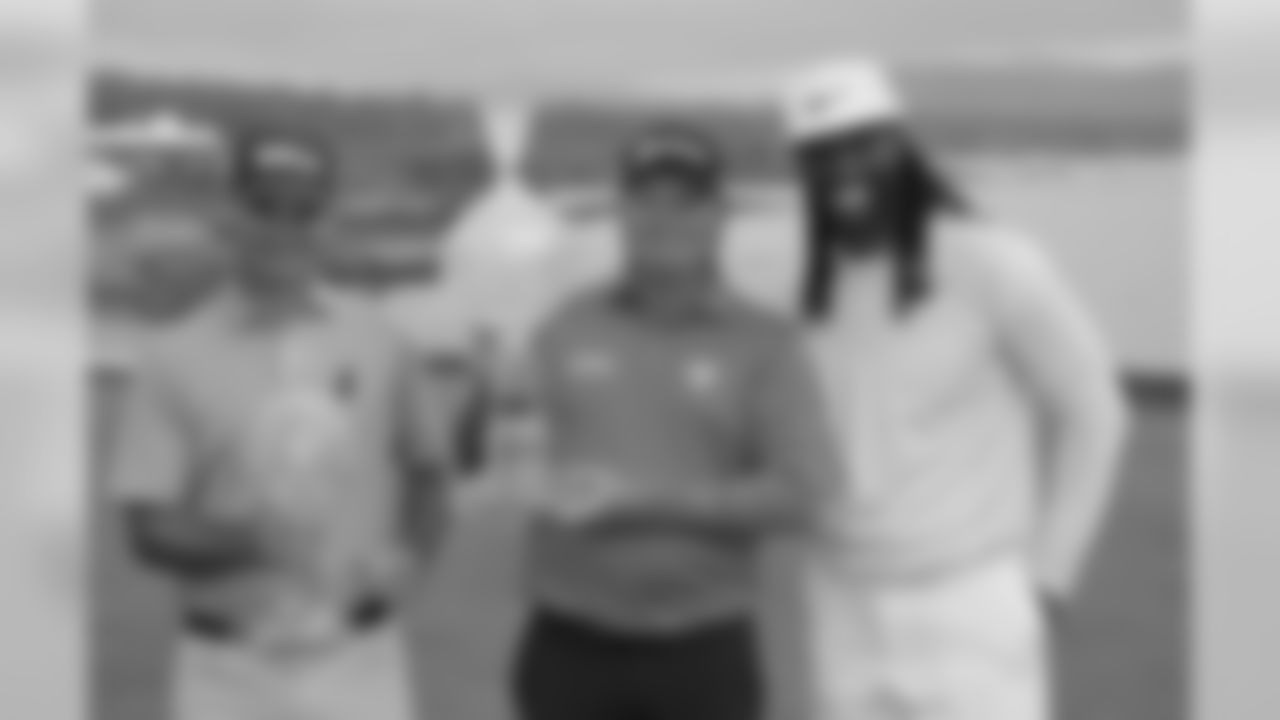 From left: Kevin Streelman, Ted Potter, Jr. and Larry Fitzgerald pose with their trophies