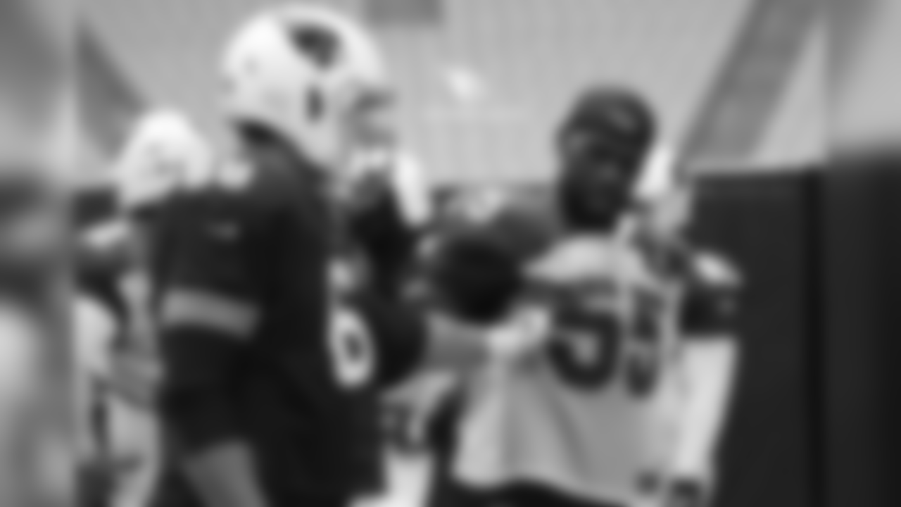 T Jared Veldheer (left) and LB Chandler Jones discuss pass-blocking