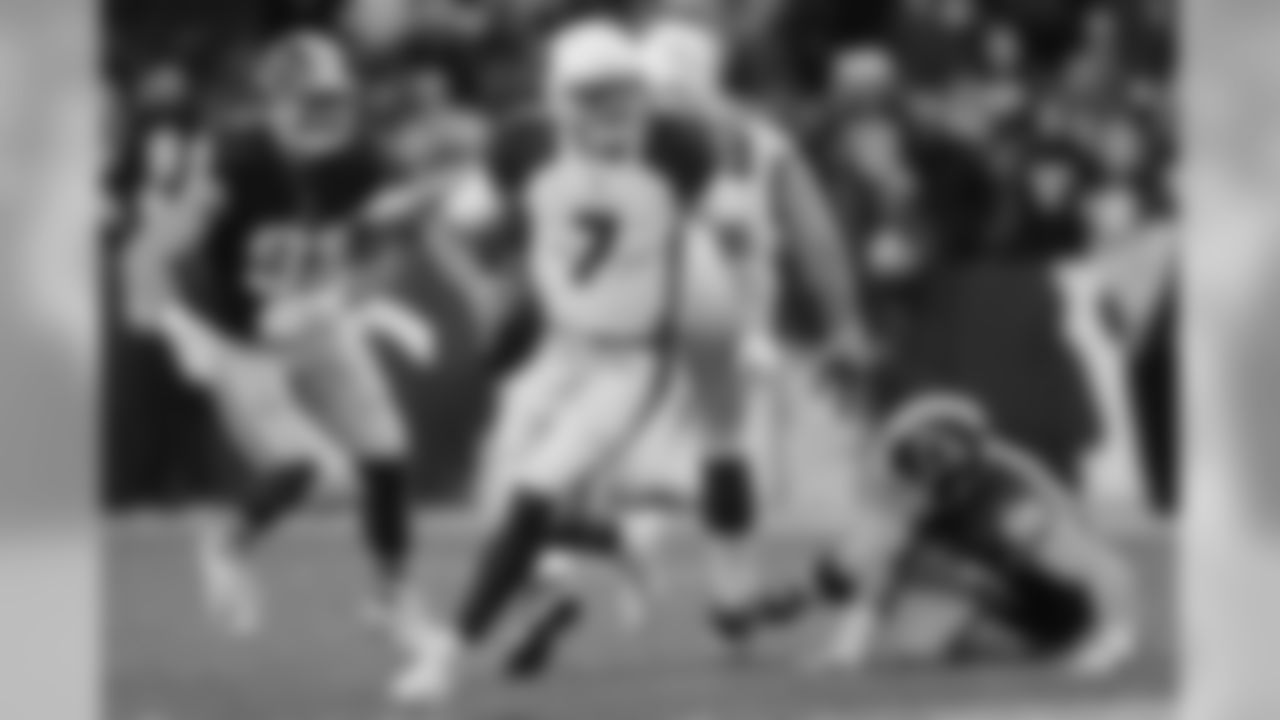 QB Blaine Gabbert looks down the field as he scrambles