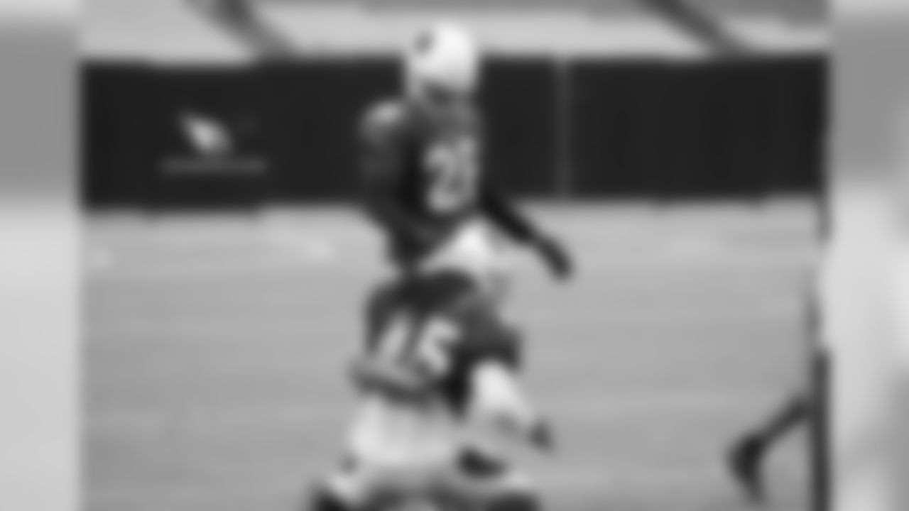 CB Justin Bethel pats LB Josh Bynes on the head
