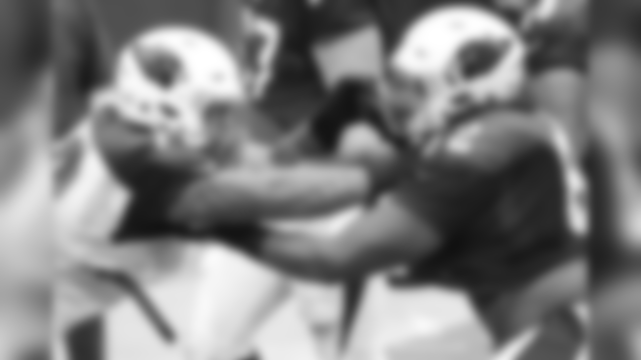 DT David Moala (left) in a pass-rushing drill against C Daniel Munyer