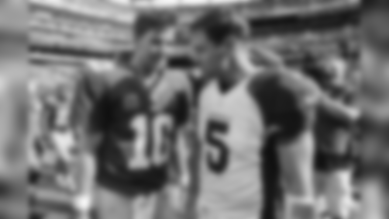 2014: Giants QB Eli Manning (left) with Cardinal QB Drew Stanton