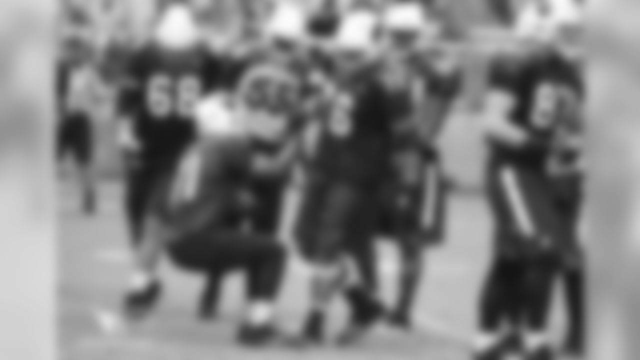 G Mike Iupati helps up RB David Johnson