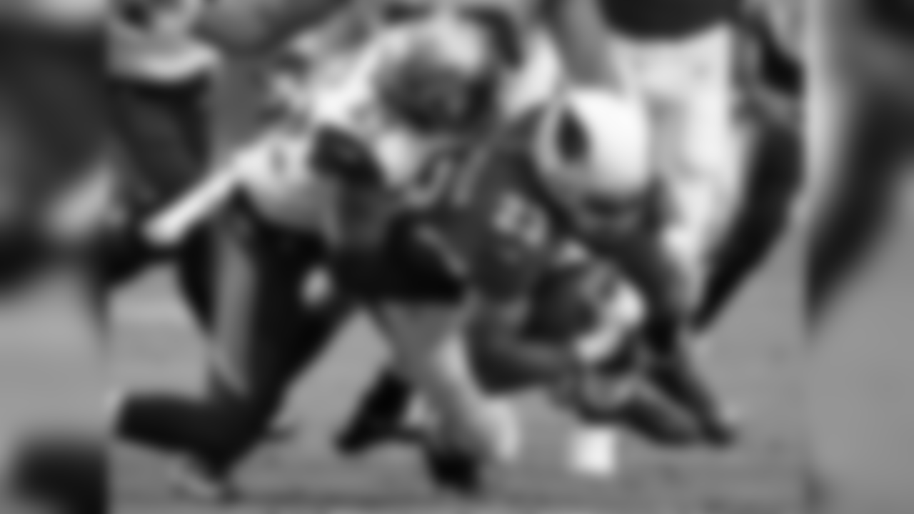 RB Adrian Peterson is brought down