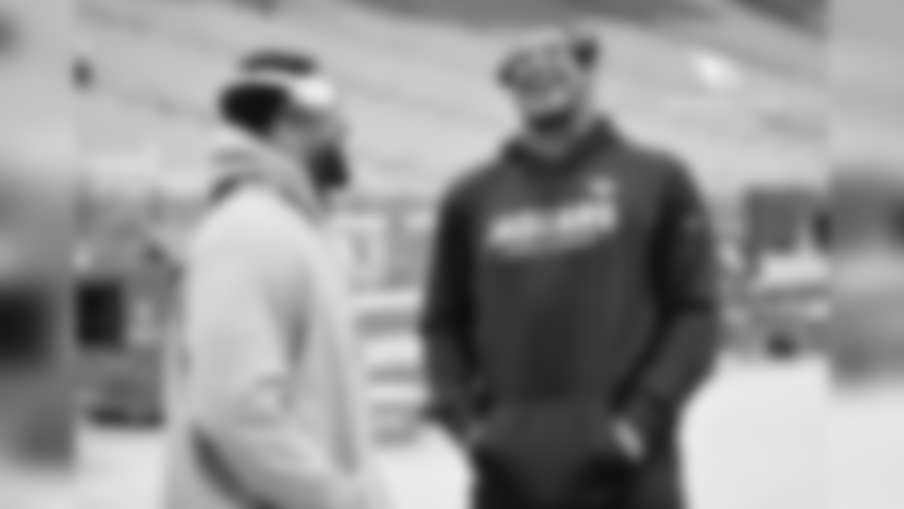 DL Corey Peters (left) catches up with former Cardinal Calais Campbell