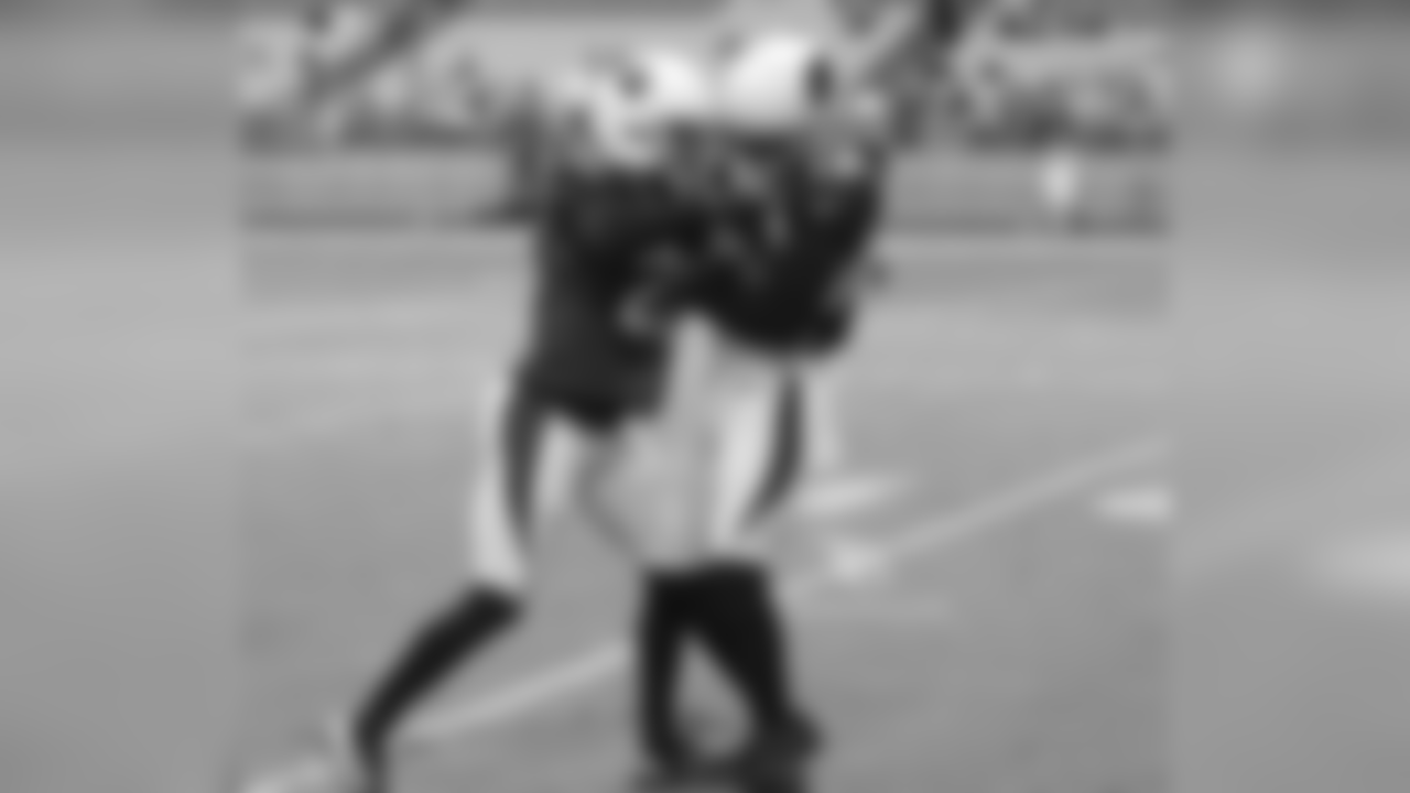 CB Justin Bethel and WR Jaron Brown battle for the ball