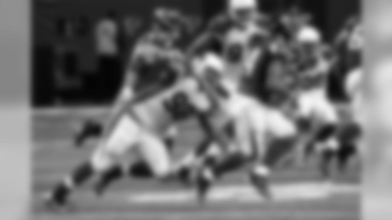 DT Corey Peters chases down Falcons RB Devonta Freeman