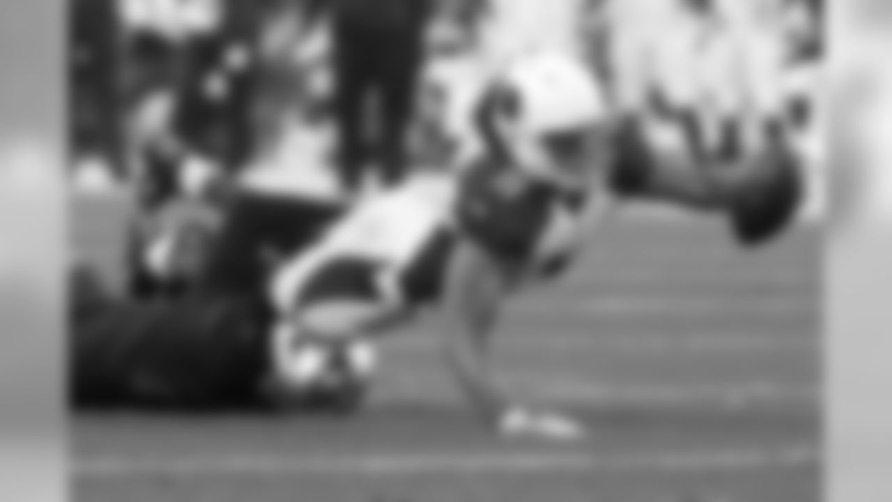 2015: WR Larry Fitzgerald stretches the ball out as he's tackled by 49ers S Jimmie Ward