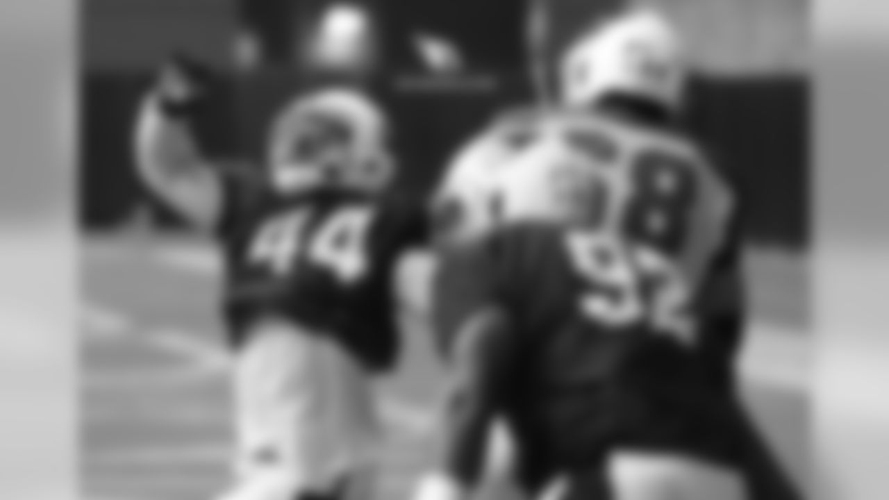 LB Markus Golden (left) goes against T Jared Veldheer in a pass-rush drill
