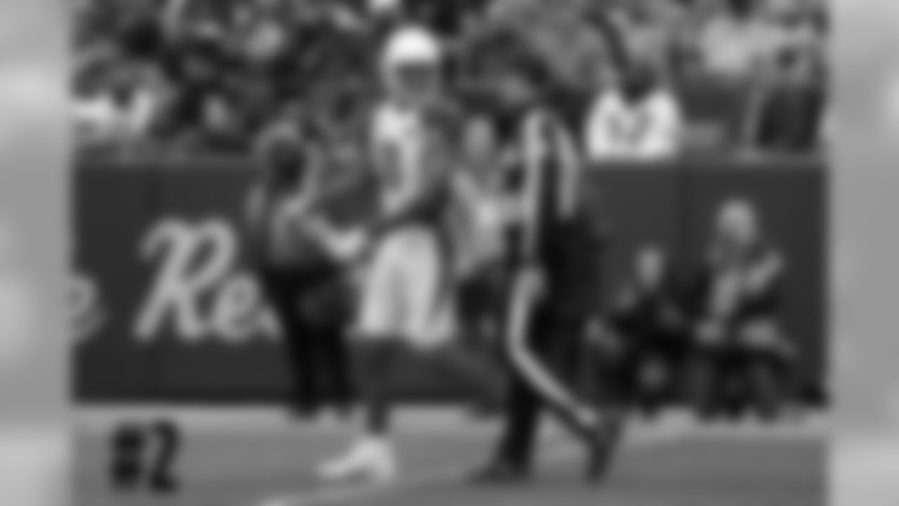 WR Larry Fitzgerald returns a penalty flag to an official