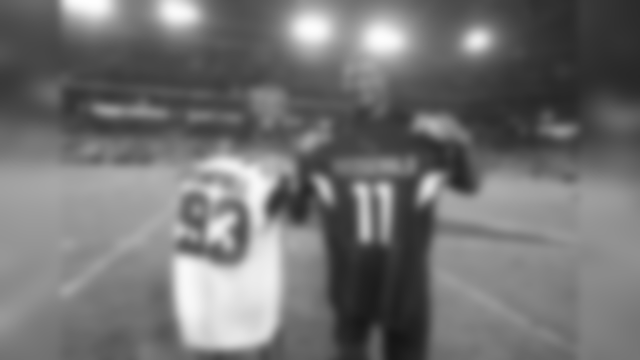 Larry Fitzgerald (left) and Calais Campbell (right) exchange jerseys after the game