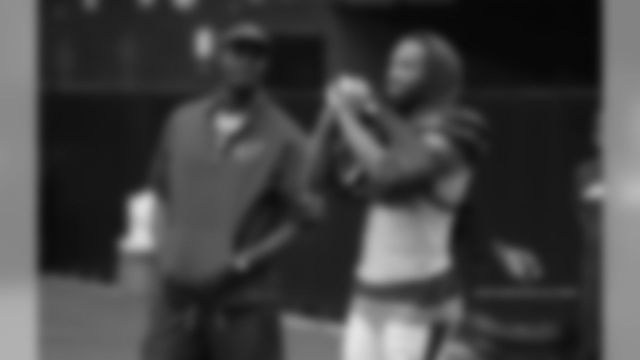 Day 12: Plaxico Burress (left) with WR Larry Fitzgerald (right)