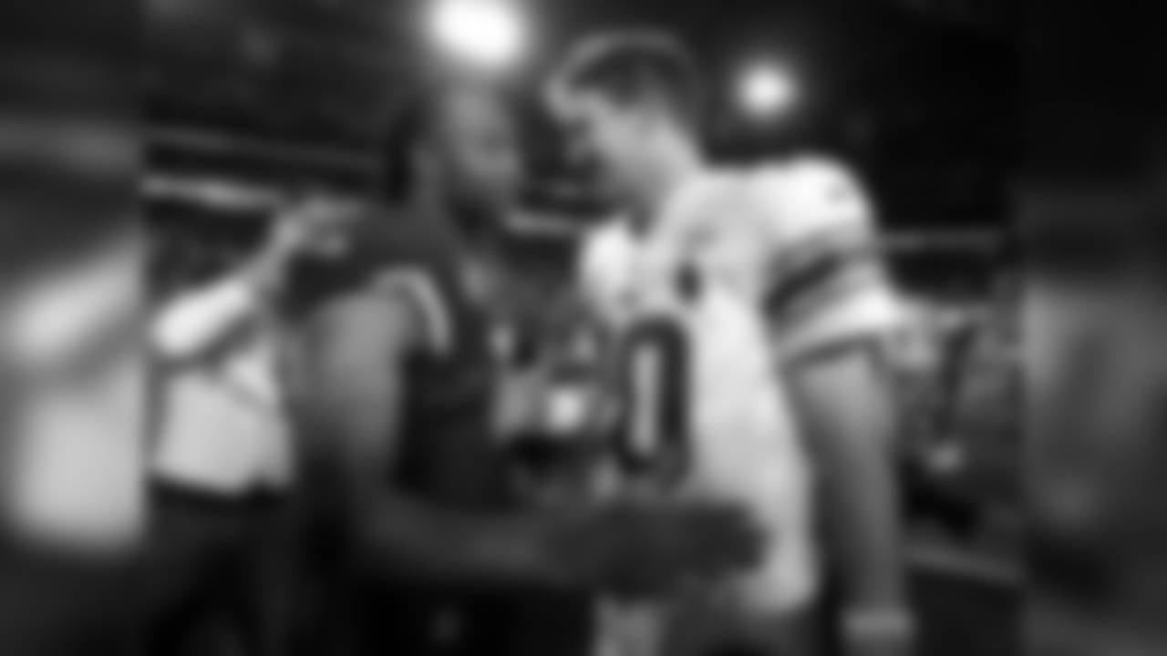 Larry Fitzgerald (left) and Eli Manning (right) meet after the game