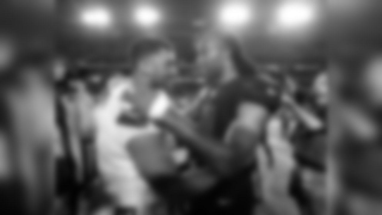 Russell Wilson (left) and Larry Fitzgerald (right) meet after the final whistle