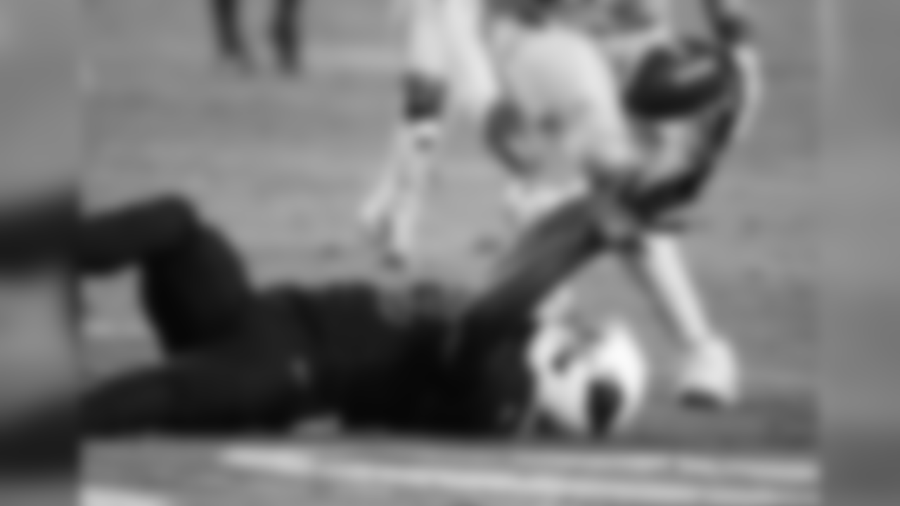WR Jaron Brown bobbles the ball