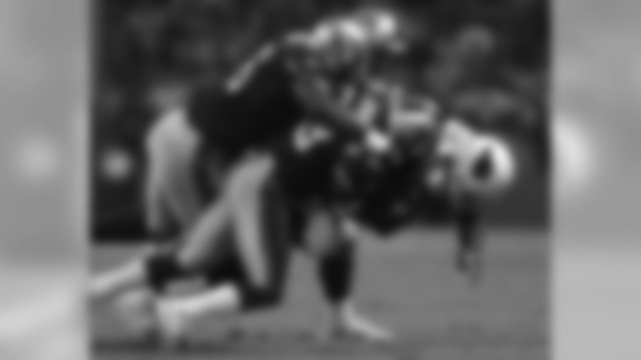 2005: WR Anquan Boldin gets tackled by three 49ers