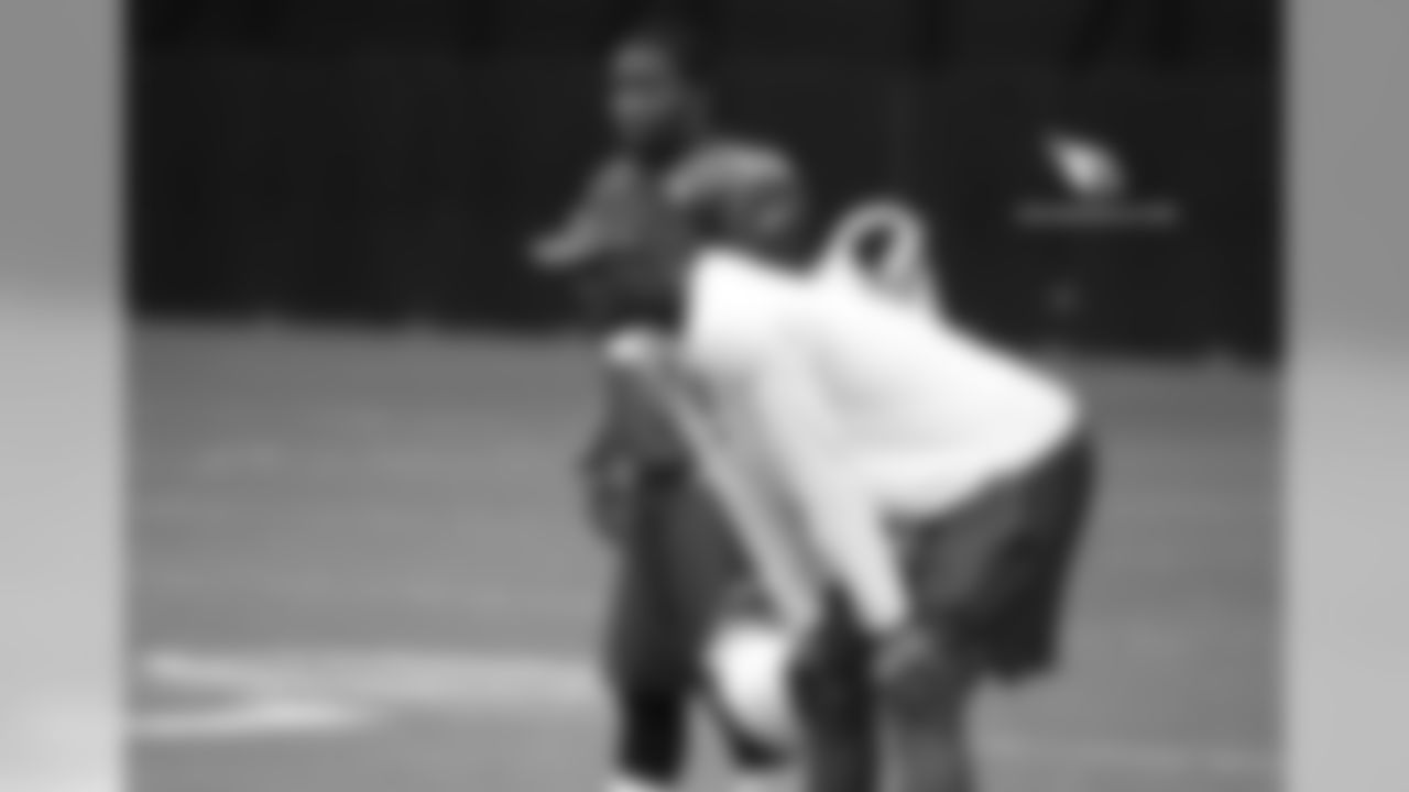 WR John Brown (back) talks to WR coaching intern Plaxico Burress