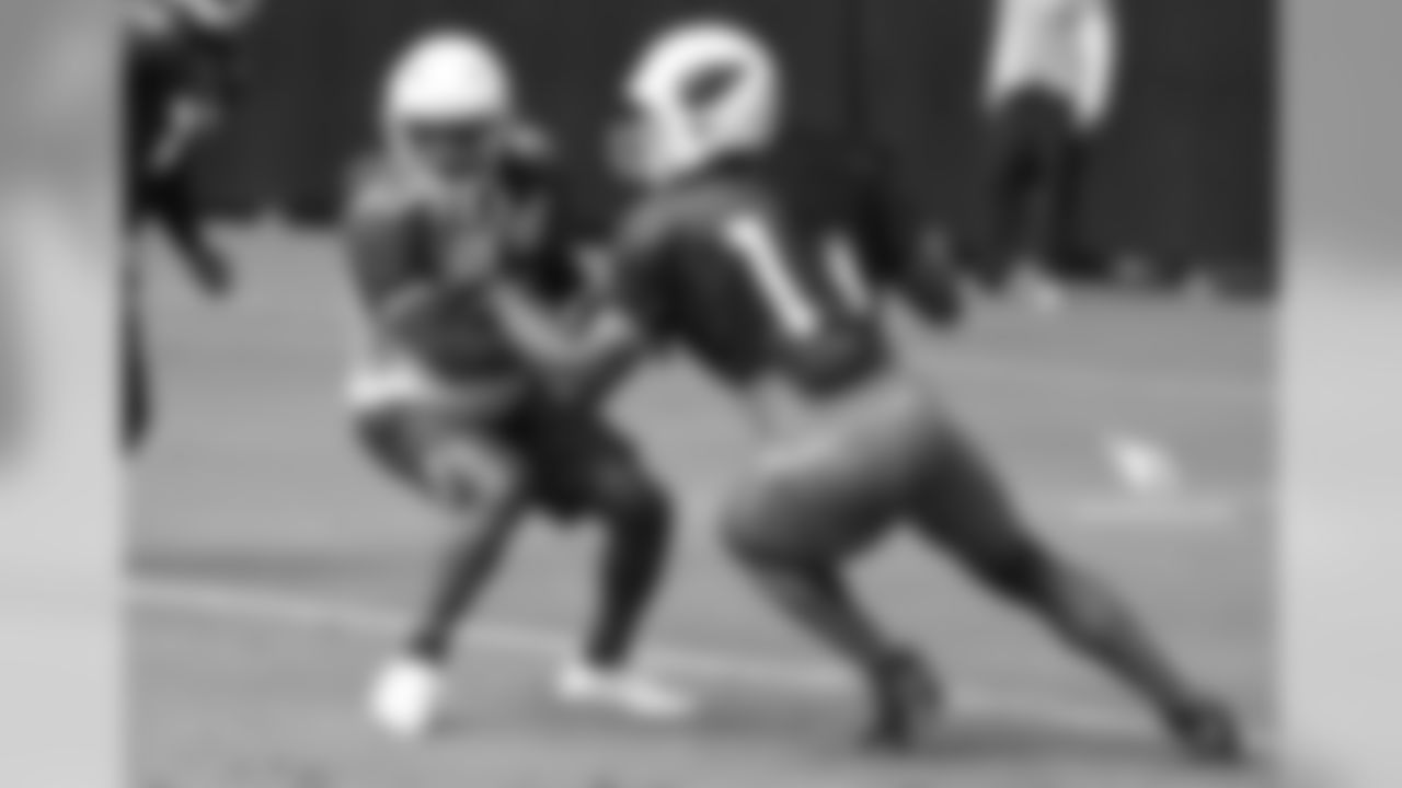 CB Tramon Williams (left) covers WR Larry Fitzgerald