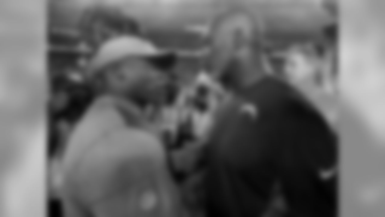 Denver Broncos head coach Vance Joseph, left, greets Los Angeles Chargers head coach Anthony Lynn after an NFL football game, Monday, Sept. 11, 2017, in Denver. The Broncos won 24-21. (AP Photo/Jack Dempsey)
