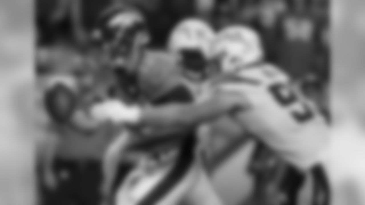 Denver Broncos quarterback Trevor Siemian (13) is hit by Los Angeles Chargers defensive end Joey Bosa (99) during the second half of an NFL football game, Monday, Sept. 11, 2017, in Denver. (AP Photo/David Zalubowski)
