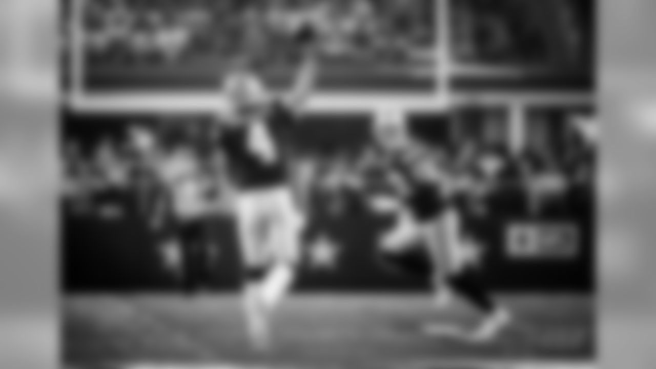Dallas Cowboys quarterback Dak Prescott (4) throws a pass to tight end Jason Witten, rear, in the first half of an NFL football game against the Los Angeles Chargers on Thursday, Nov. 23, 2017, in Arlington, Texas. (AP Photo/Ron Jenkins)
