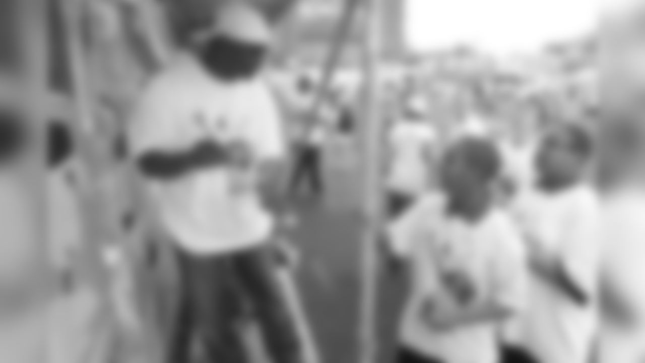Dawkins interacts with kids at the annual Eagles Youth Partnership Playground Build